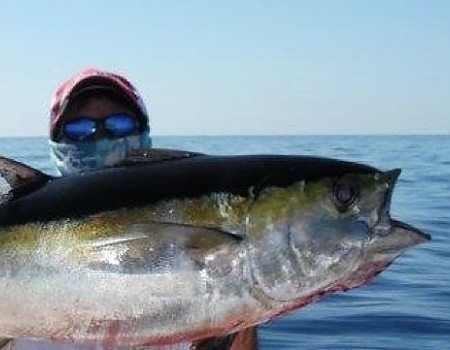 Man holding up his catch.