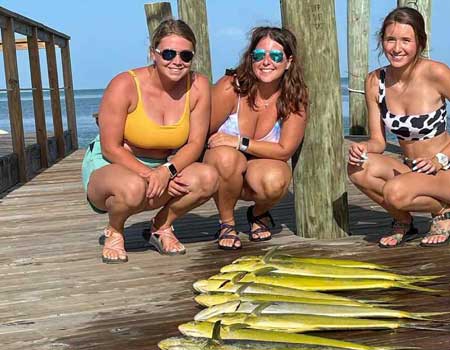 Women posing with catch